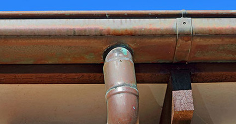A piece of copper guttering pipe.