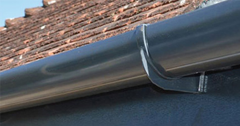 A piece of black plastic guttering.