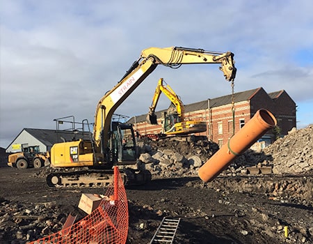 ULTRA3 630mm pipe being lifted by a digger.