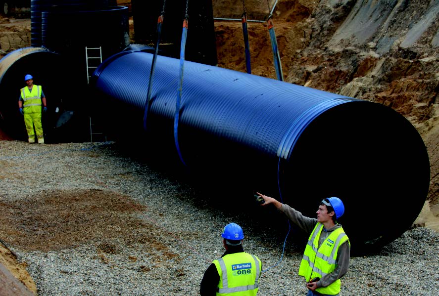 Large diameter HDPE pipework being installed.