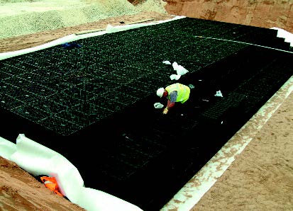 Membrane around an attenuation tank being installed.