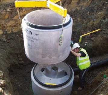 Concrete ring being installed