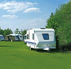 Caravan in field